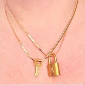 Louis Vuitton Gold Padlock and key #302 EUC